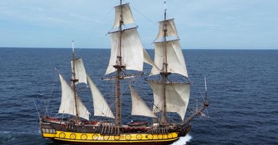 Tall ship banned from festival over captain's nationality seen floating near harbour