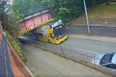 Double decker bus crashes into bridge in Manchester