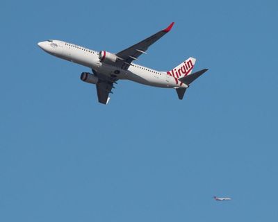 Fire in overhead locker on Virgin Australia flight believed to be caused by lithium battery in power bank