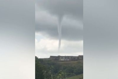 Moment ‘tornado’ swirls over UK village caught on camera