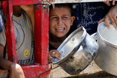‘Flour, fire and fear as I try to parent in a starving Gaza’