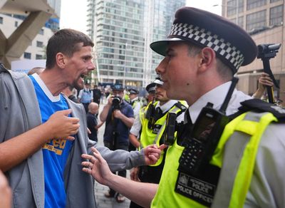 Met Police attend second night of protests at Canary Wharf hotel set to house migrants