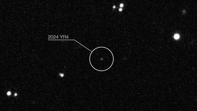 How do scientists calculate the probability that an asteroid could hit Earth?