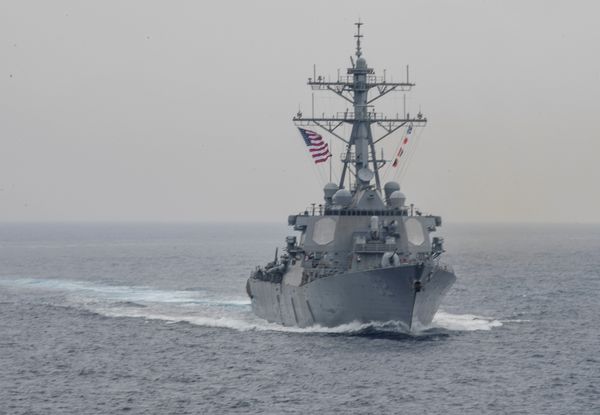 Iranian helicopter confronts US warship approaching territorial waters