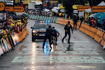 Man invades finish line at Tour de France, taken out by police