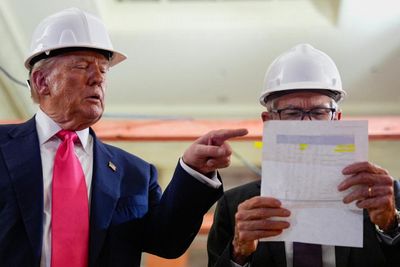 Trump tussles with Jerome Powell on rare visit to Federal Reserve