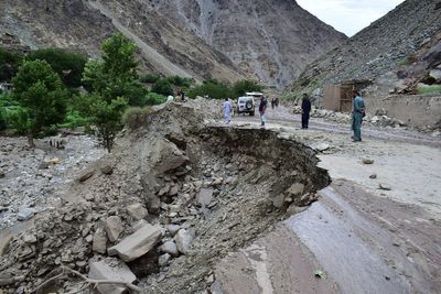 Rescuers expand search in northern Pakistan for 12 missing tourists swept away by floods
