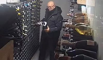 Moment burglar who stole £24,000 of wine from London celebrity restaurant is caught in the act