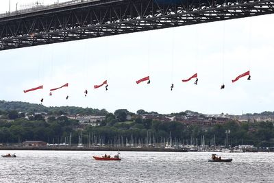 Greenpeace protesters close Forth Road Bridge after abseiling off the side