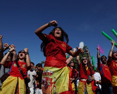 Defeated but proud: Madrileños brave the heat to roar on La Roja