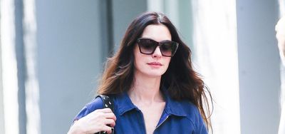 Anne Hathaway's denim jumpsuit and chunky sandals is a lesson in smart casual summer dressing