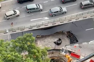 Singapore migrant workers hailed as heroes for saving woman from sinkhole