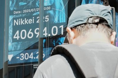Asian shares mostly slip as focus shifts to US talks with China