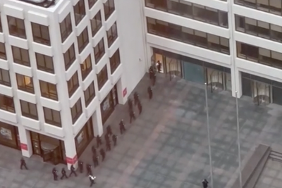 Police descend on New York City skyscraper after police officer and three others killed in Manhattan shooting