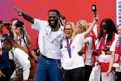 Burna Boy dances with England manager Sarina Wiegman at Euro 2025 victory parade