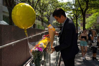 Victims of New York City shooting include a police officer and an executive at investment firm