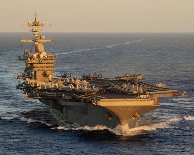 Search under way for US sailor missing from USS George Washington in sea north of Australia