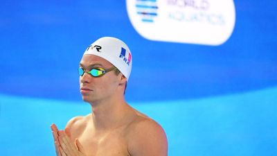 French swimming sensation Marchand eases into semis at world championships