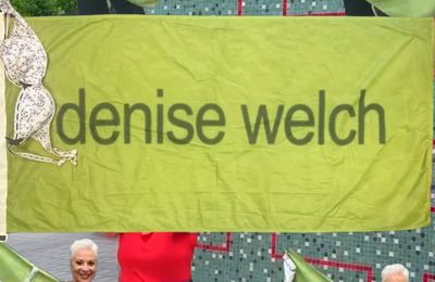 Denise Welch auctioning off Glastonbury Brat flag