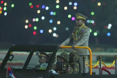 Myanmar ends state of emergency and military leader switches roles to prepare for polls