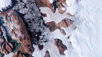 Satellites reveal a hidden lake burst through Greenland Ice Sheet in 2014, causing major flooding and a deep crater