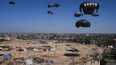 Planes drop humanitarian aid into Gaza Strip as Israeli fire reportedly kills at least 18