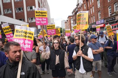 Rival groups gather as asylum hotel protest begins