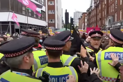 Police scuffle with protesters outside hotel housing immigrants