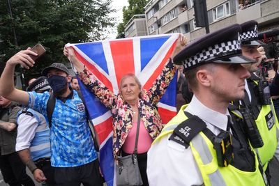 Rival groups clash outside London asylum hotel as police issue arrest warnings