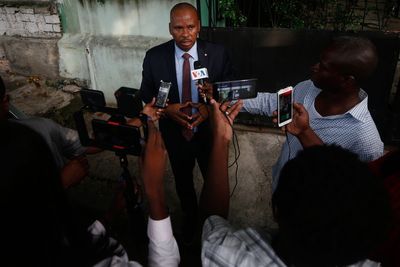 Haitian police arrest a former senator accused of working with gangs to attack a peaceful community