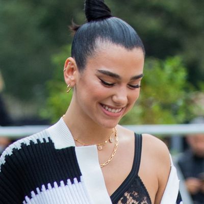 Dua Lipa Pairs Puma Metallic Sneakers and a $6,000 Chanel Bag With Her Prada Matching Set