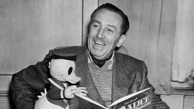 Walt Disney's 1950s living room is bathed in timeless, rich reds – 75 years later, we're still coveting the versatile shade