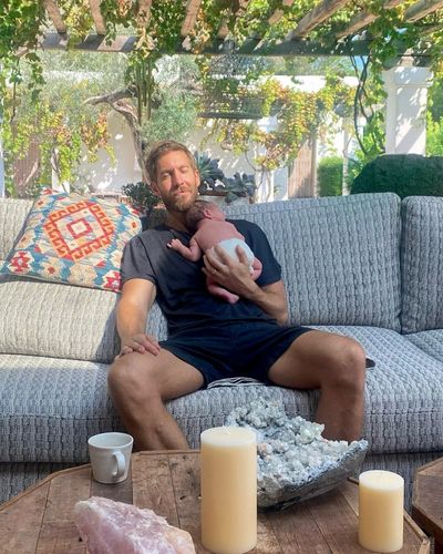 Calvin Harris reveals he's become a dad as he praises 'superhero' wife Vick Hope following outdoor birth