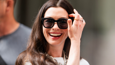 Anne Hathaway sets a stylish example of what to wear to the office this autumn, but it's her sleek handbag that's stealing the show