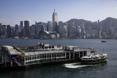 Hong Kong cancels passports, bans financial support for wanted activists