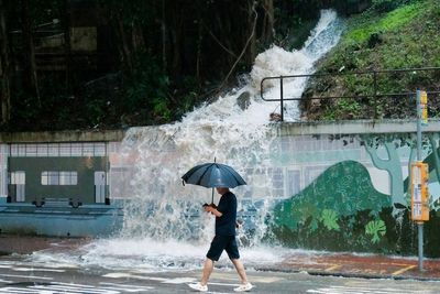 Black storm warning paralyses Hong Kong as torrential rain triggers floods and landslides