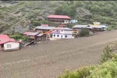 Village buried in mud as flash flooding kills at least four in northern India