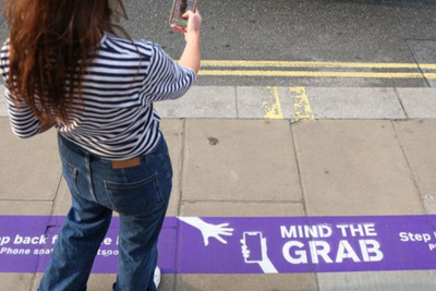 ‘Mind the grab’: Oxford Street shop paints phone theft warnings onto street