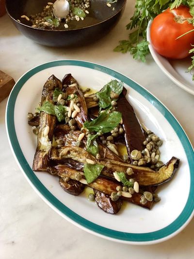 Rachel Roddy’s recipe for sweet-and-sour aubergines with capers, pine nuts and mint
