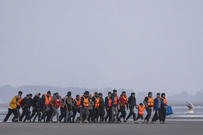 UK Says First Migrants Held Under Return Deal With France