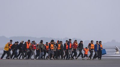 UK says first migrants held under return deal with France