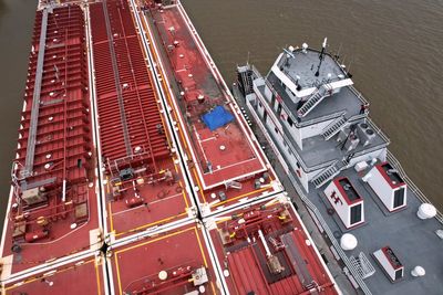 Two dead after helicopter crashes into power lines before slamming into barge