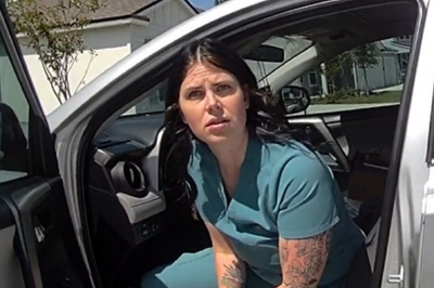 Moment fake nurse who treated 4,000 patients without a license is arrested by police