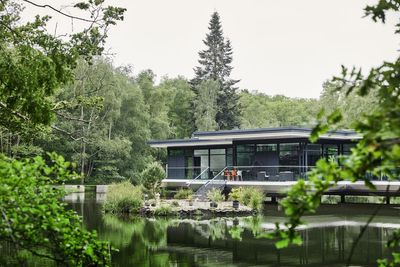 Eco-house on stilts built over a private lake with a Japanese island garden for sale for £4.25m