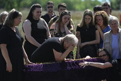 'Back Home': Family Who Fled Front Buried After Kyiv Strike