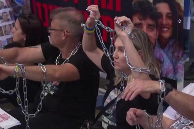 Families of Israeli hostages chain themselves outside Netanyahu’s office in Gaza plan protest