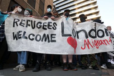 Arrests made during demonstrations outside Canary Wharf hotel as protests take place across UK
