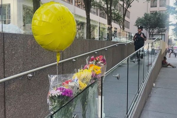 Hundreds honor security guard killed in New York office tower shooting