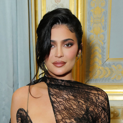Kylie Jenner Pairs a Chloé Sheer Lace Blouse With Jennifer Lawrence's $890 Flip-Flops and a Rare Hermès JPG Shoulder Birkin