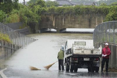 Heavy rains in southern Japan cause flooding and mudslides, and leave several people missing